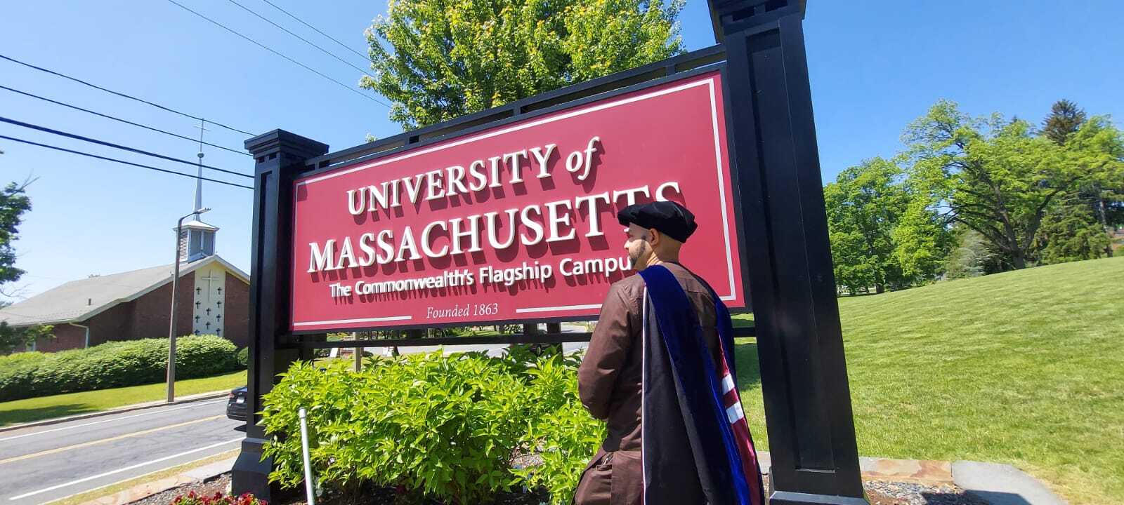 UMass Sign Cap and Gown